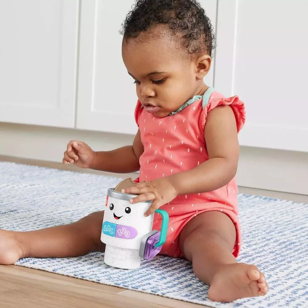 Fisher-Price Baby & Toddler Toy Laugh & Learn Wake Up & Learn Coffee Mug. Safe Play Design Made with safe, baby-friendly materials, this toy is both durable and easy for little hands to hold, offering a secure and enjoyable play experience. HRP35 thumbnail