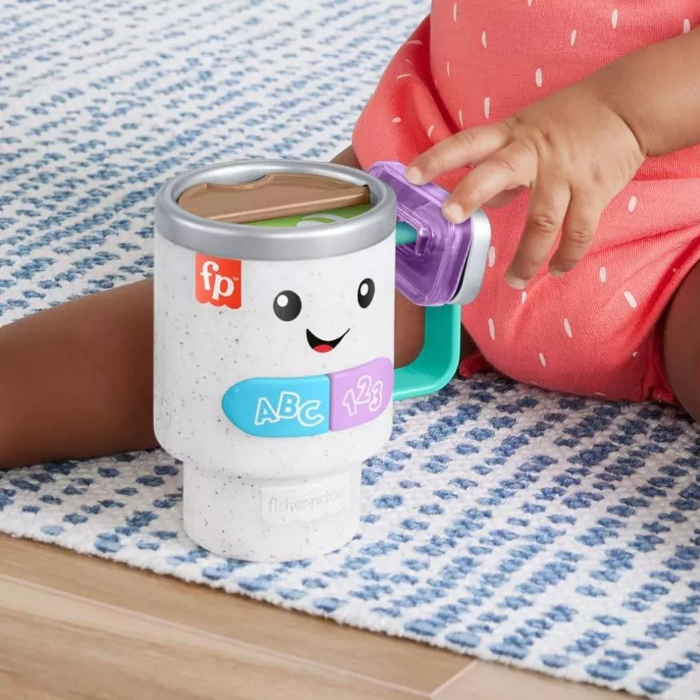 Fisher-Price Baby & Toddler Toy Laugh & Learn Wake Up & Learn Coffee Mug. Safe Play Design Made with safe, baby-friendly materials, this toy is both durable and easy for little hands to hold, offering a secure and enjoyable play experience. HRP35 thumbnail